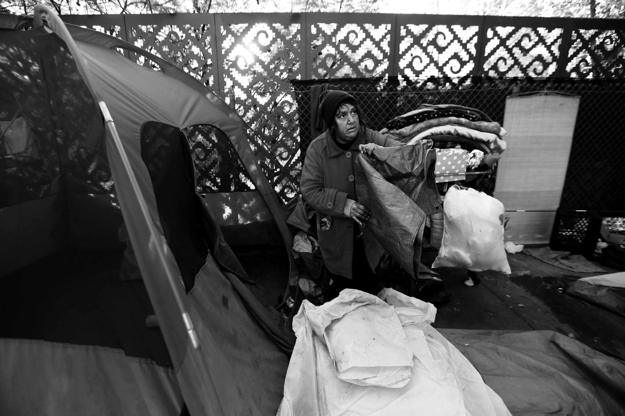 LOS ANGELES, CA FEBRUARY 13, 2017: Angel Barros, 48, packs up her tent in preparation for sidewa
