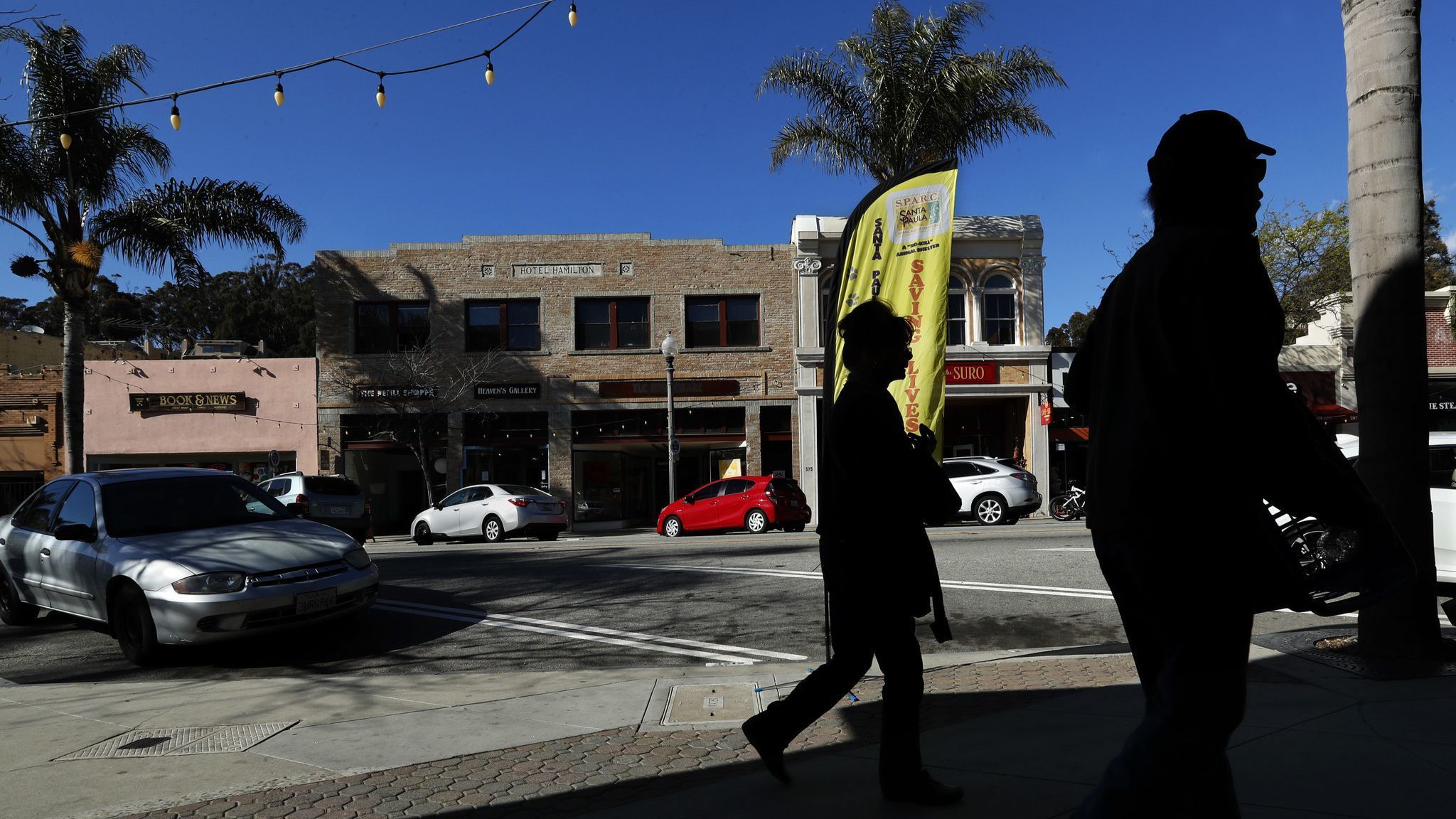 VENTURA, CA-MARCH 26, 2018: Pedestrians walk along Main St. in downtown Ventura with the Hotel Hami