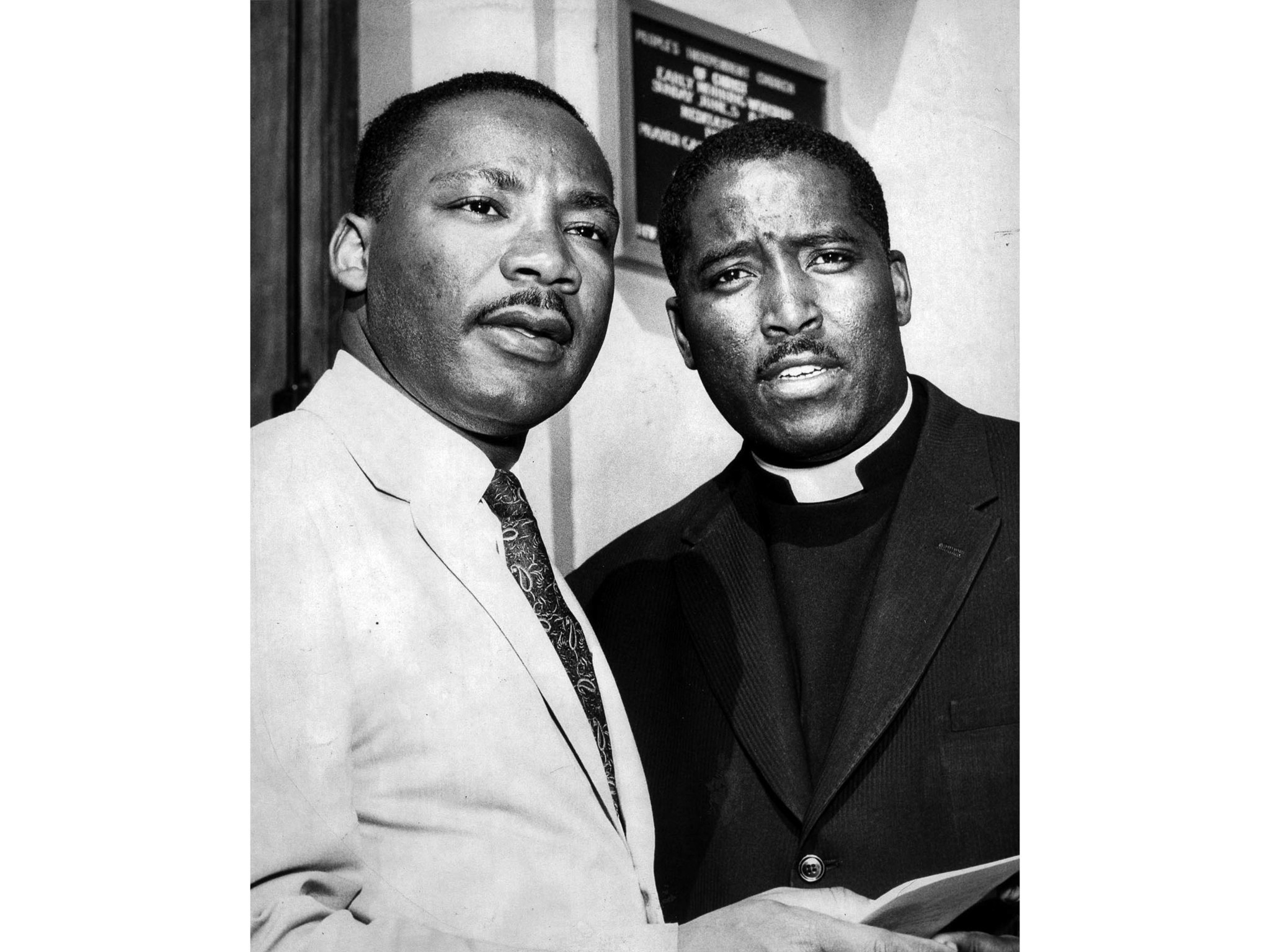 July 9, 1960: Dr. Martin Luther King, left and Rev. Maurice Dawkins, minister of the People's Indepe