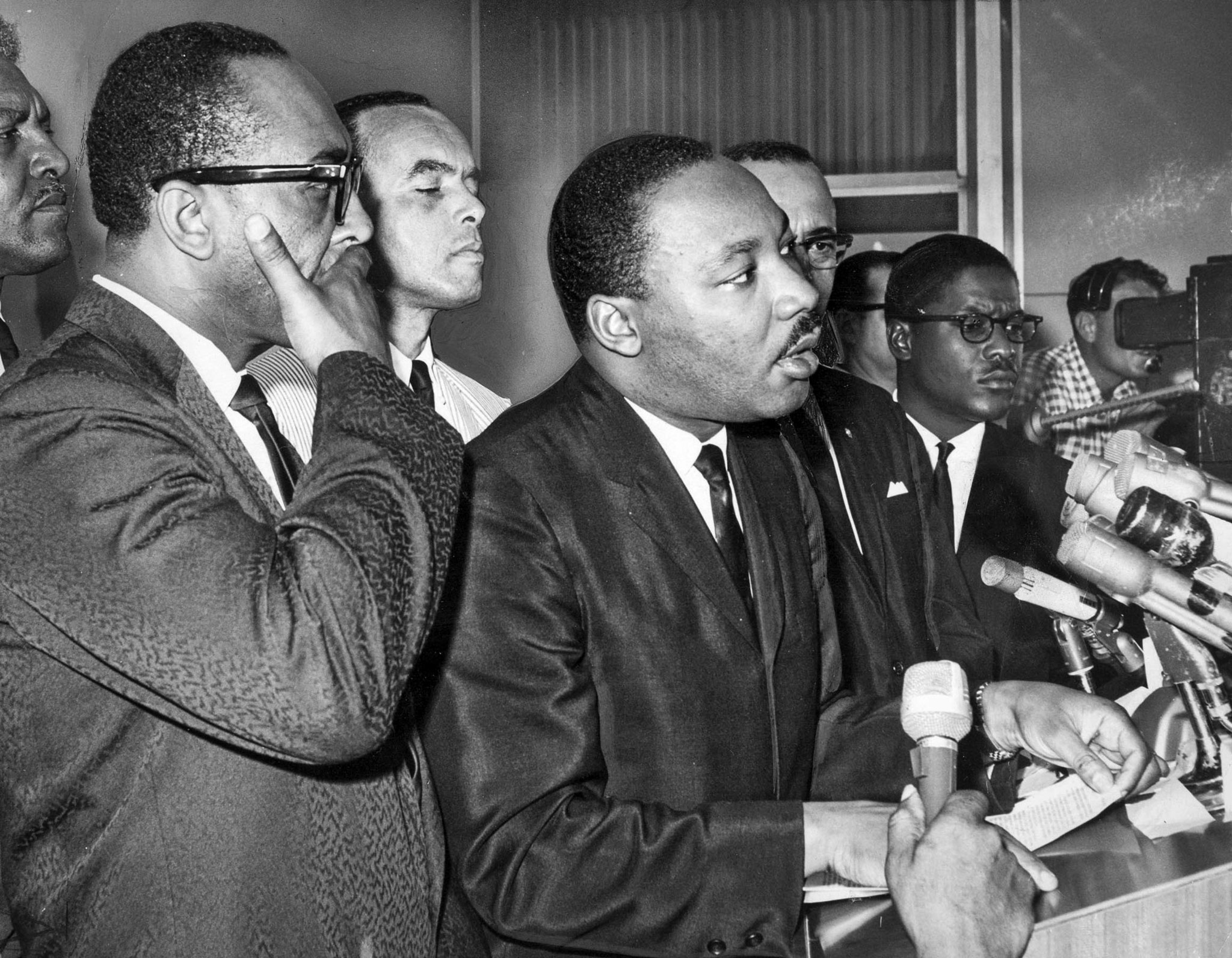 Aug. 17, 1965: Dr. Martin Luther King at podium after arrival at Los Angeles International Airport.