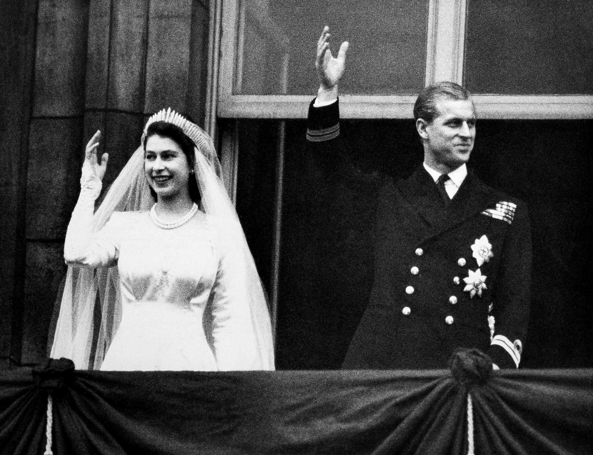Princess Elizabeth and Prince Philip, Duke of Edinburgh make a charming picture as they wave to the