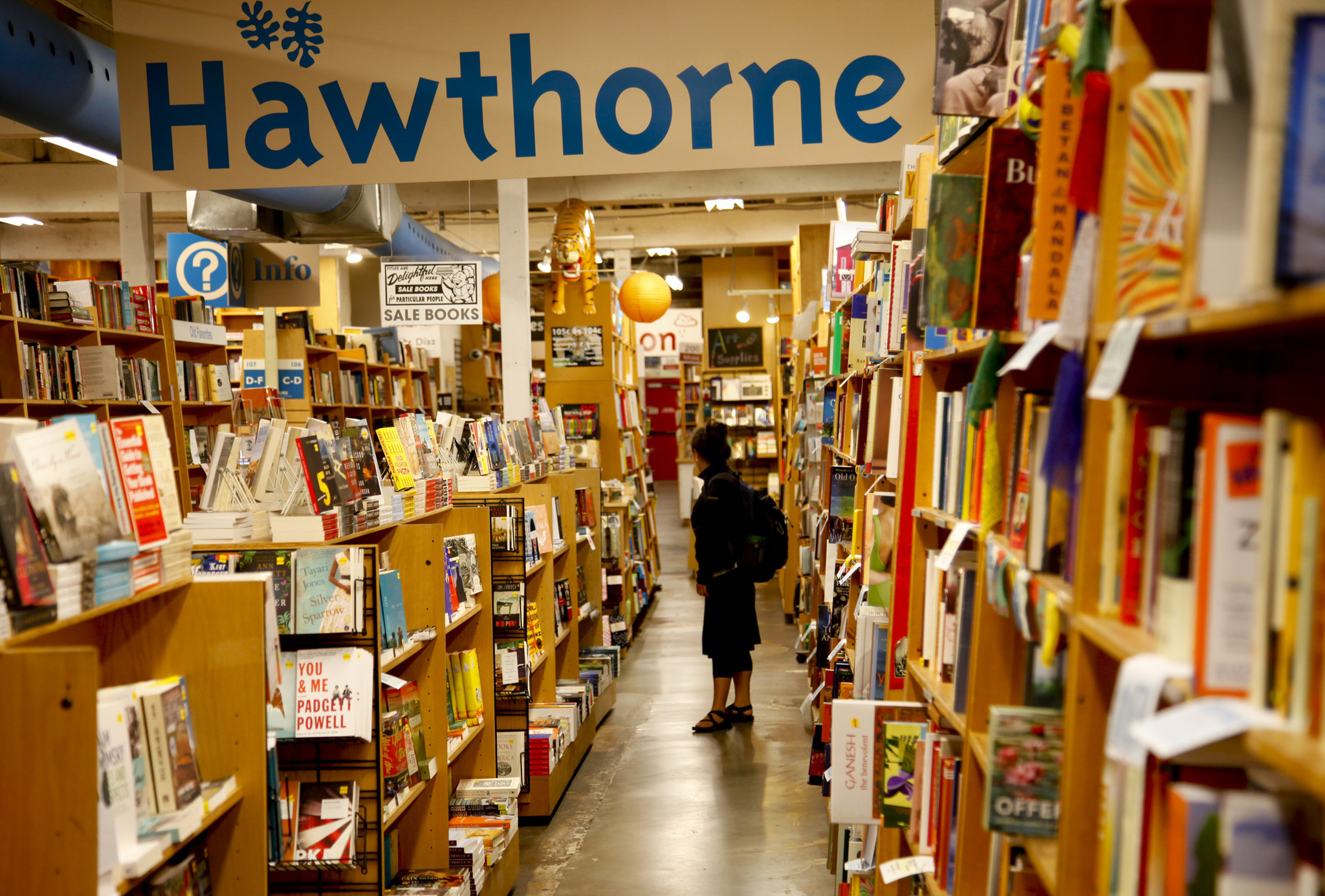 PORTLAND, OREGON, AUGUST 1, 2013 : Customer browse the shelves stuffed with books at Powell's Books