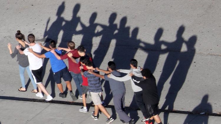 Students escorted from Stoneman Douglas the day of the shooting.