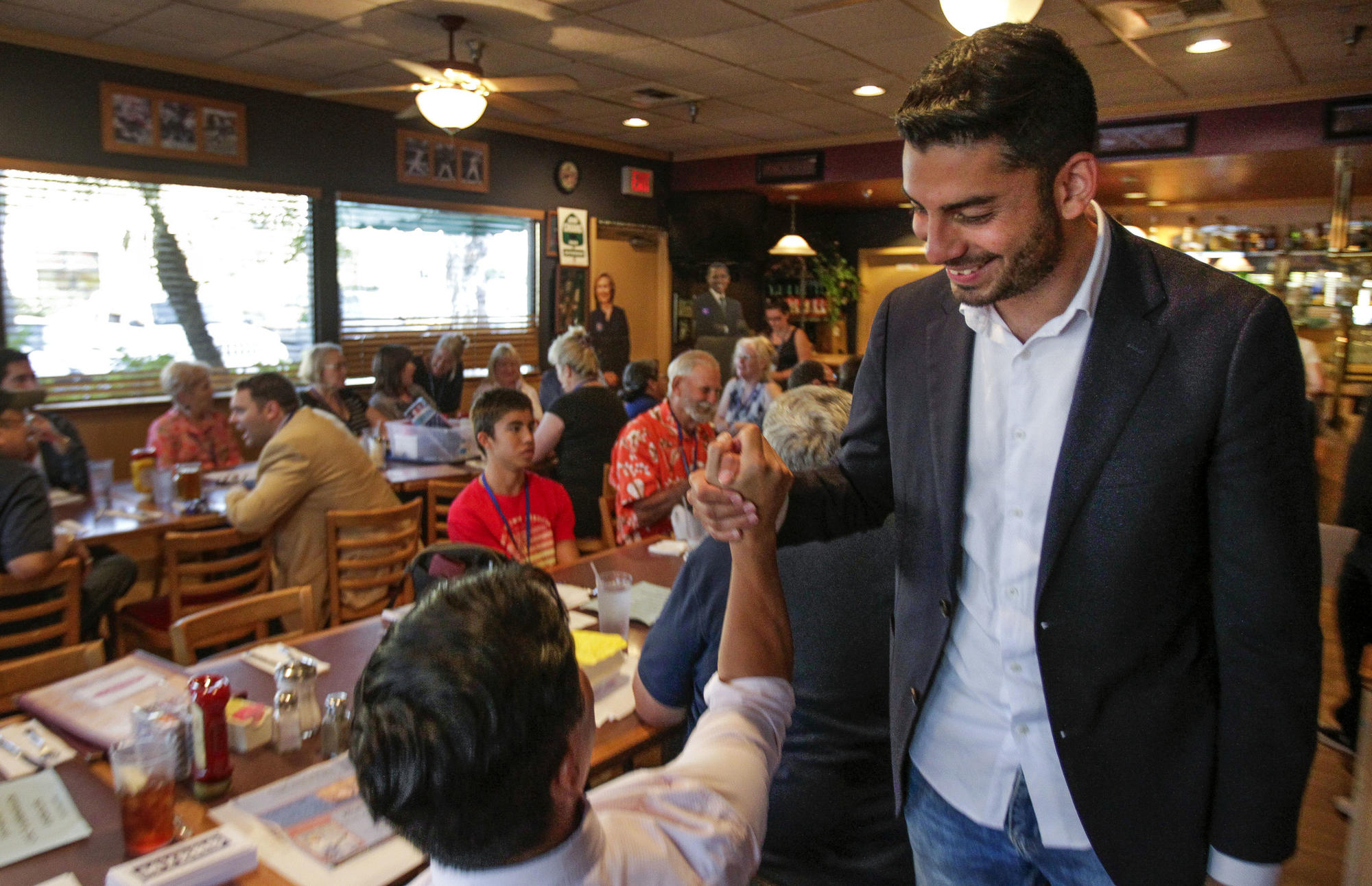 SANTEE, August 17, 2017 | Ammar Campa-Najjar, 28, a candidate for 50th congressional district, shake