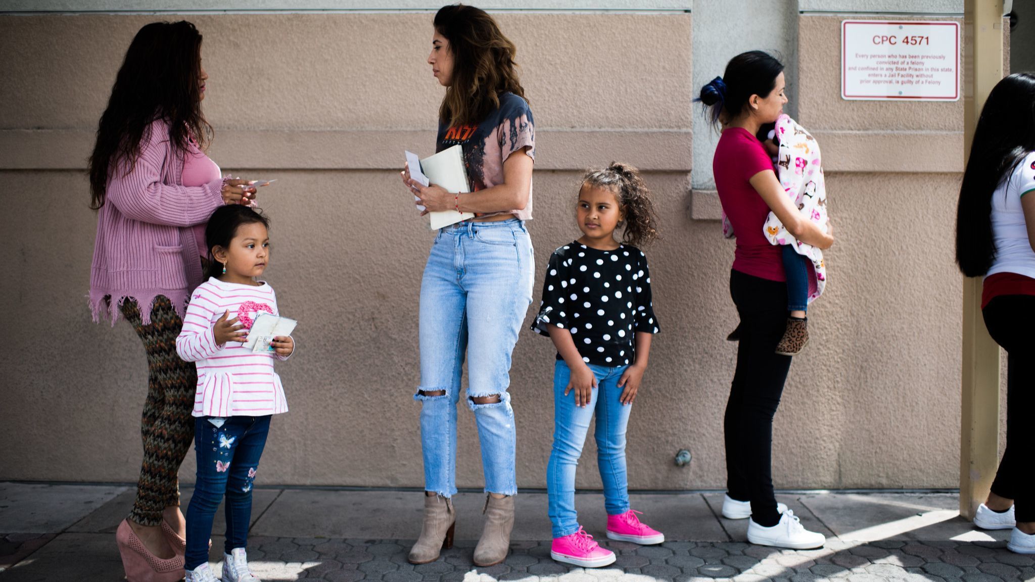 ORANGE, CA - June 23, 2018 Natalie Garcia and her daughter Marley Hodges wait in a line for a visit