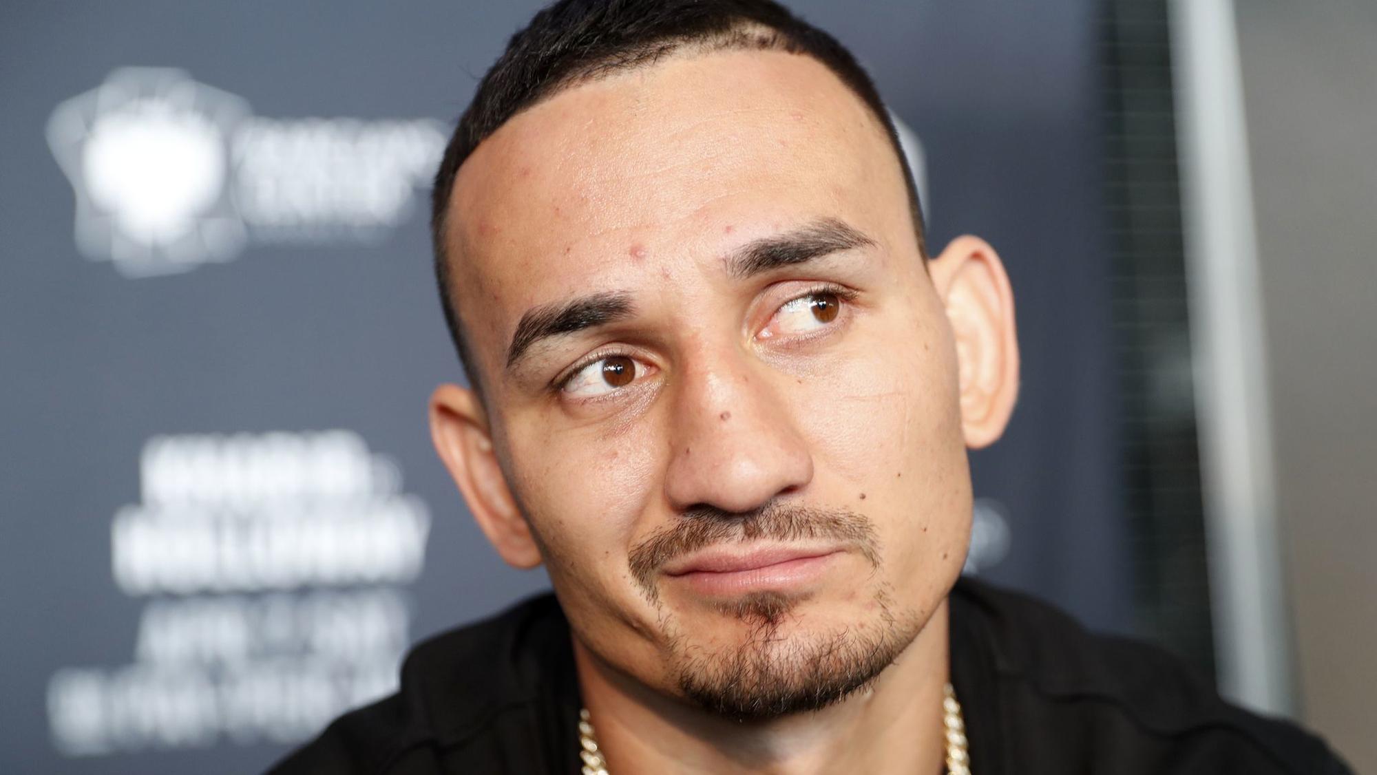 UFC featherweight champ Max Holloway drops out of fight because of