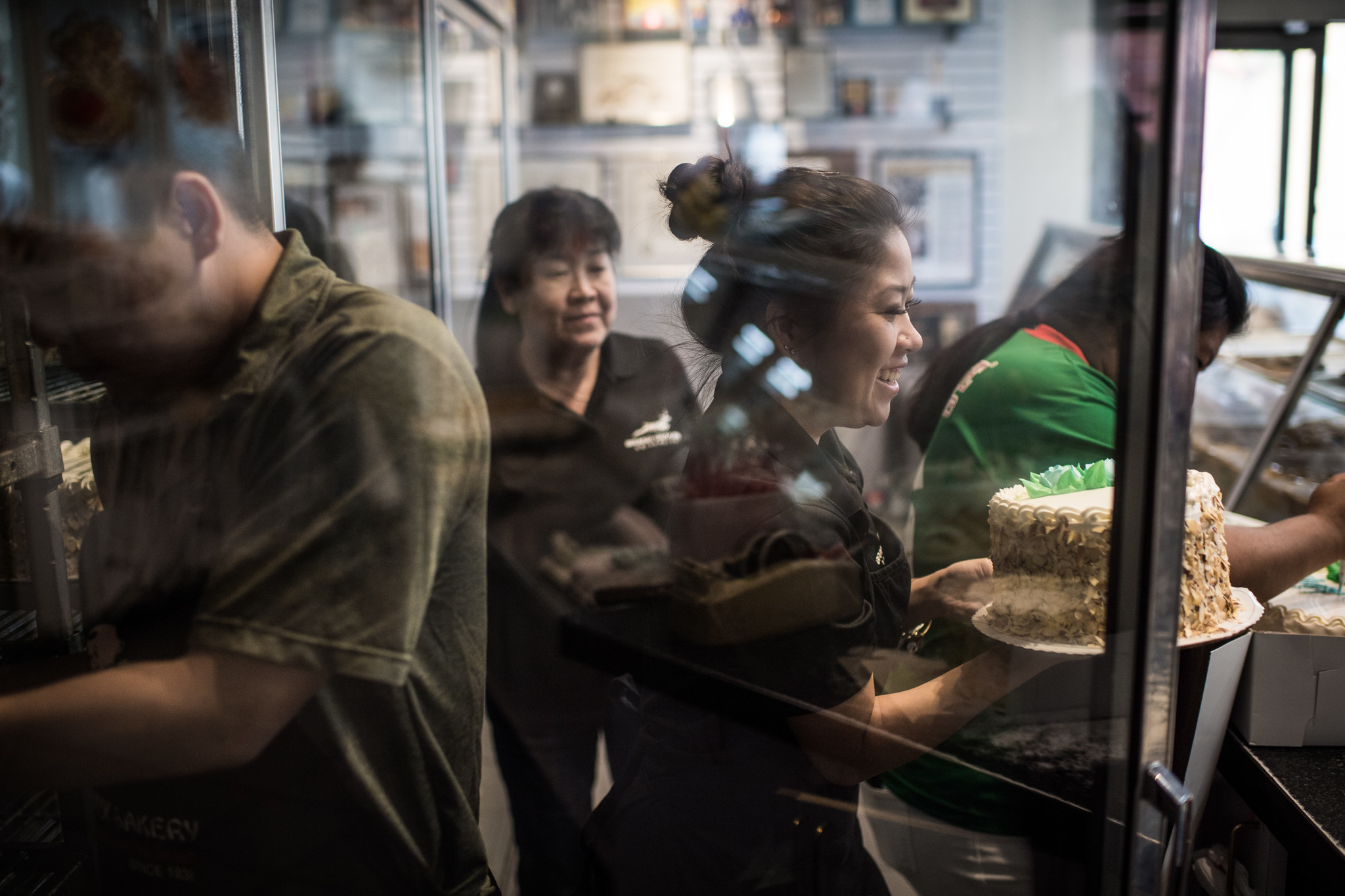 LOS ANGELES, CA - June 17, 2018 Melissa Chan serves a customer at Phoenix Bakery in Chinatown, a fa