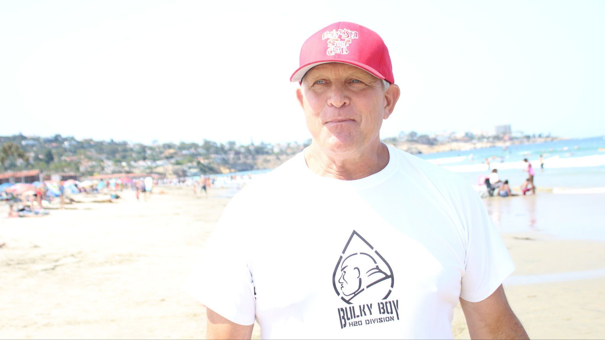 WindanSea Surf Club president Bill Fitzmaurice reflects on his club's history during its latest Day at the Beach charity event at La Jolla Shores.