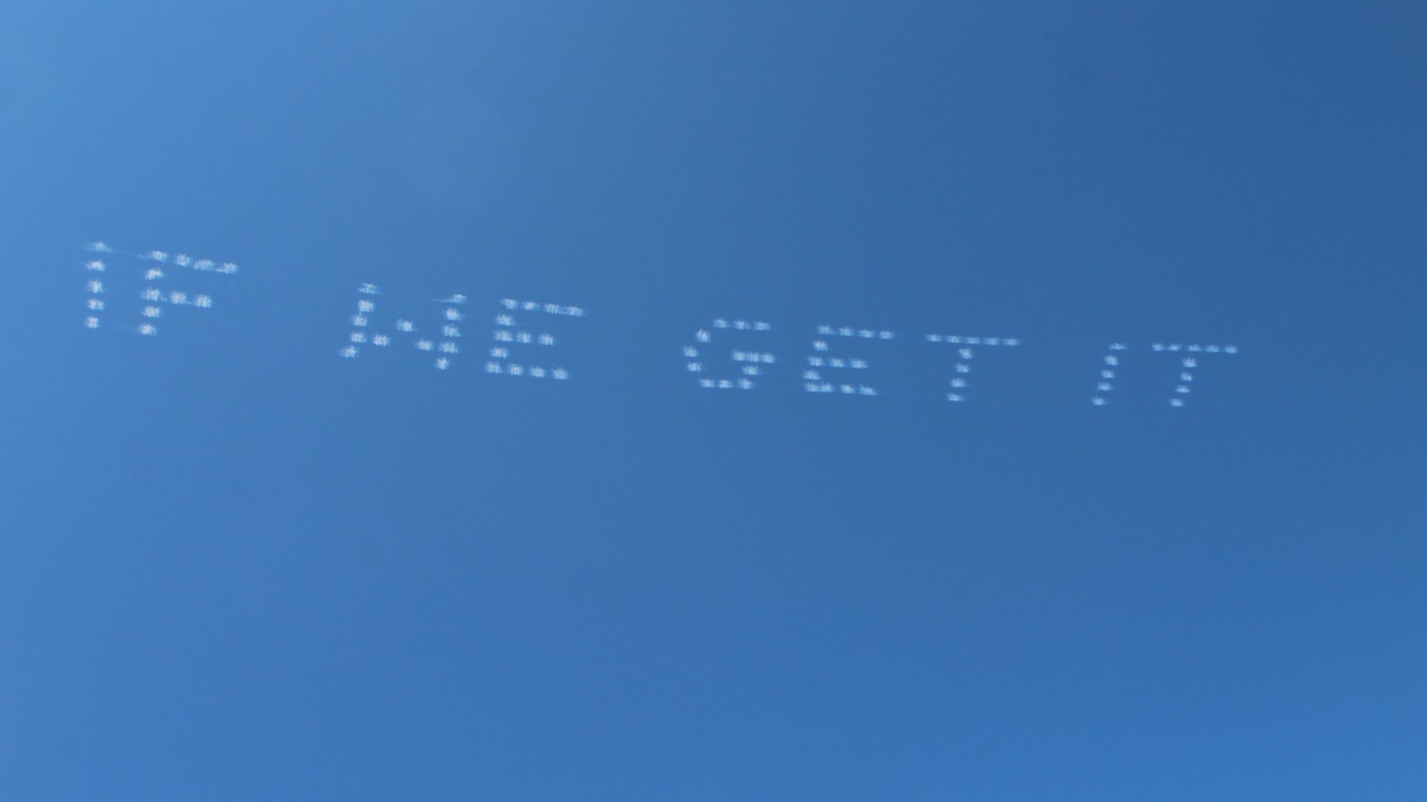 The first four words of the poem are puffed out by a Las Vegas-based skywriting crew called Skytypers.