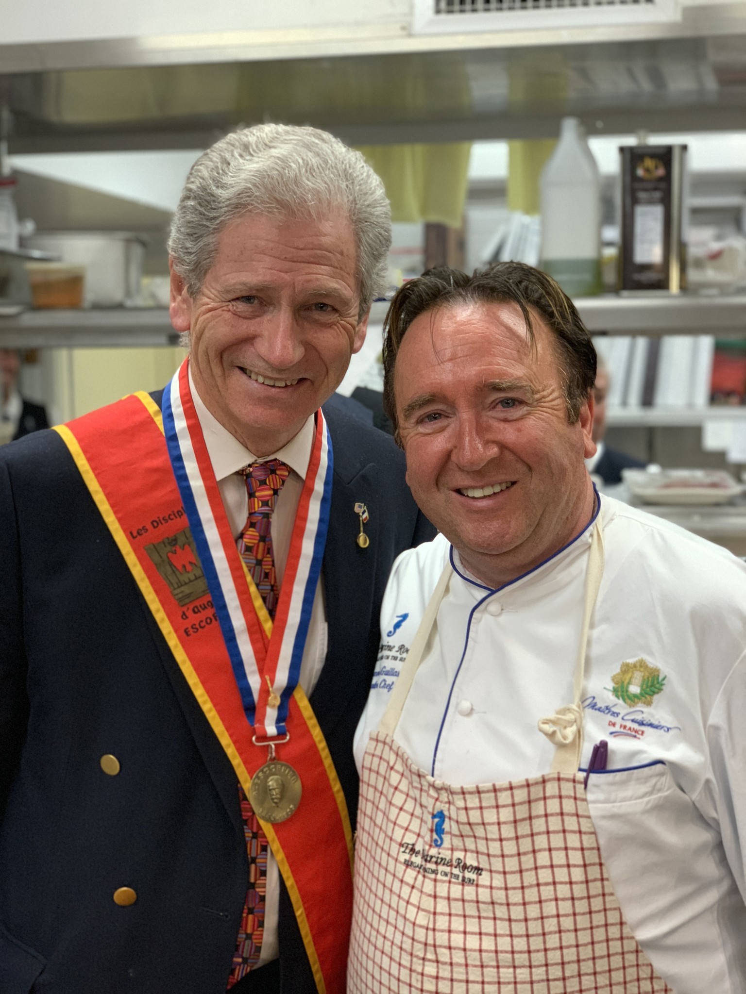 Michel Escoffier poses with Bernard Guillas in the Marine Room kitchen before the ceremony.