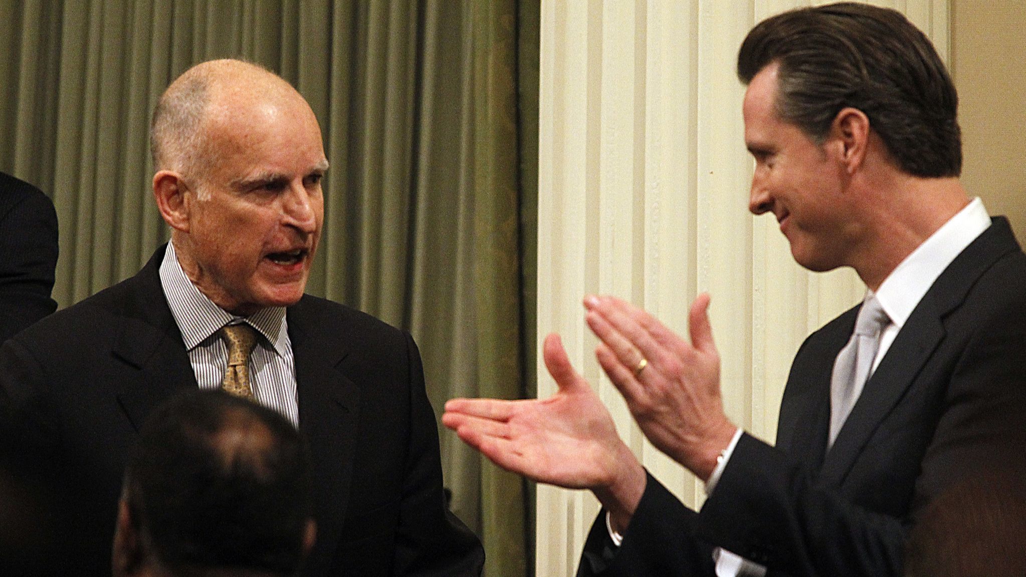 SACRAMENTO, CALIF. - JAN> 24, 2013. California Gov. Jerry Brown , left, is applauded by Lt. Gov. Gav