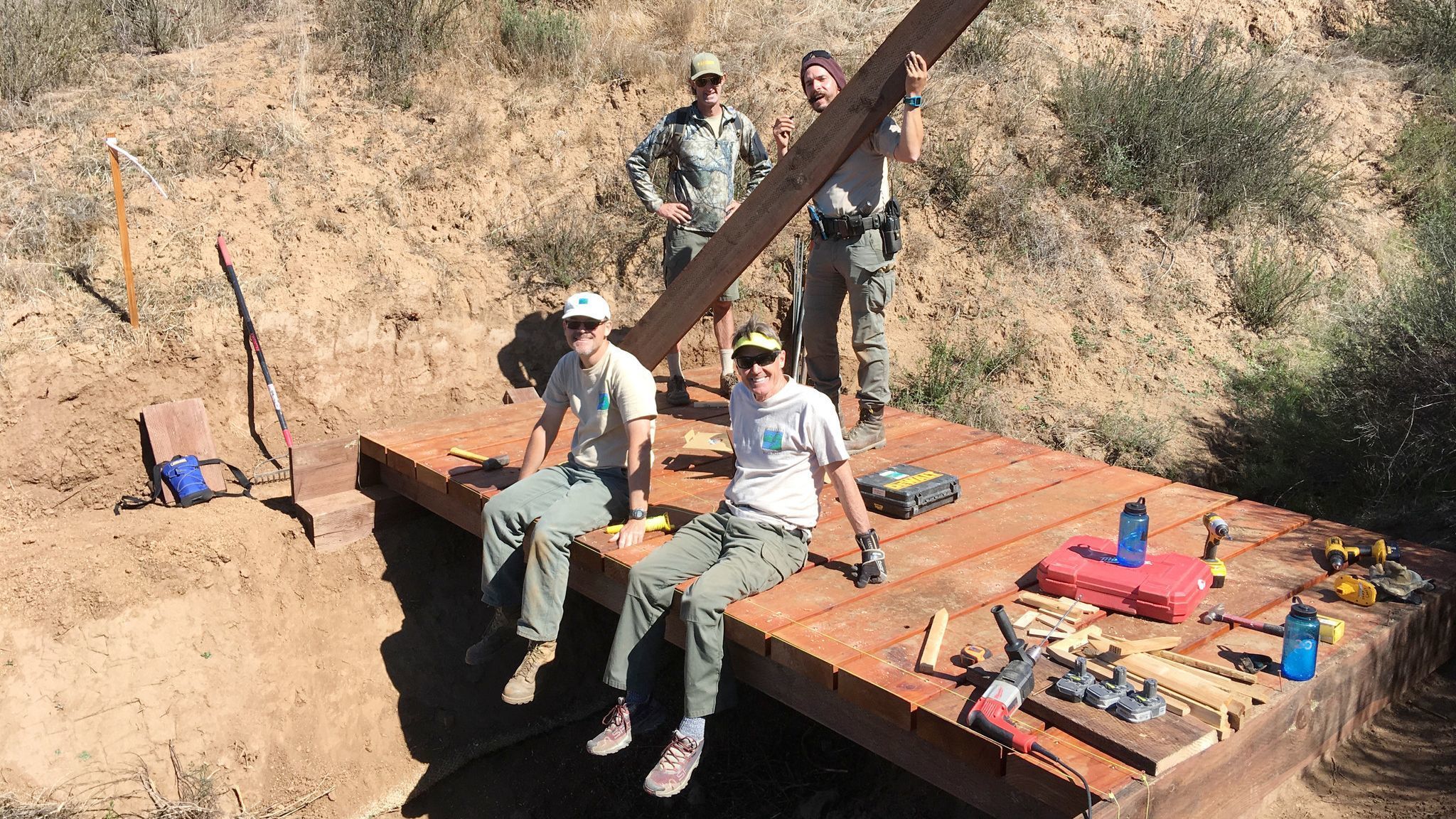 Trails crew are, standing from left, San Dieguito River Park Rangers David Hekel and Felipe Franco-Ortiz, and, sitting from left, volunteers Jack Bochsler and Bernie Bonar.