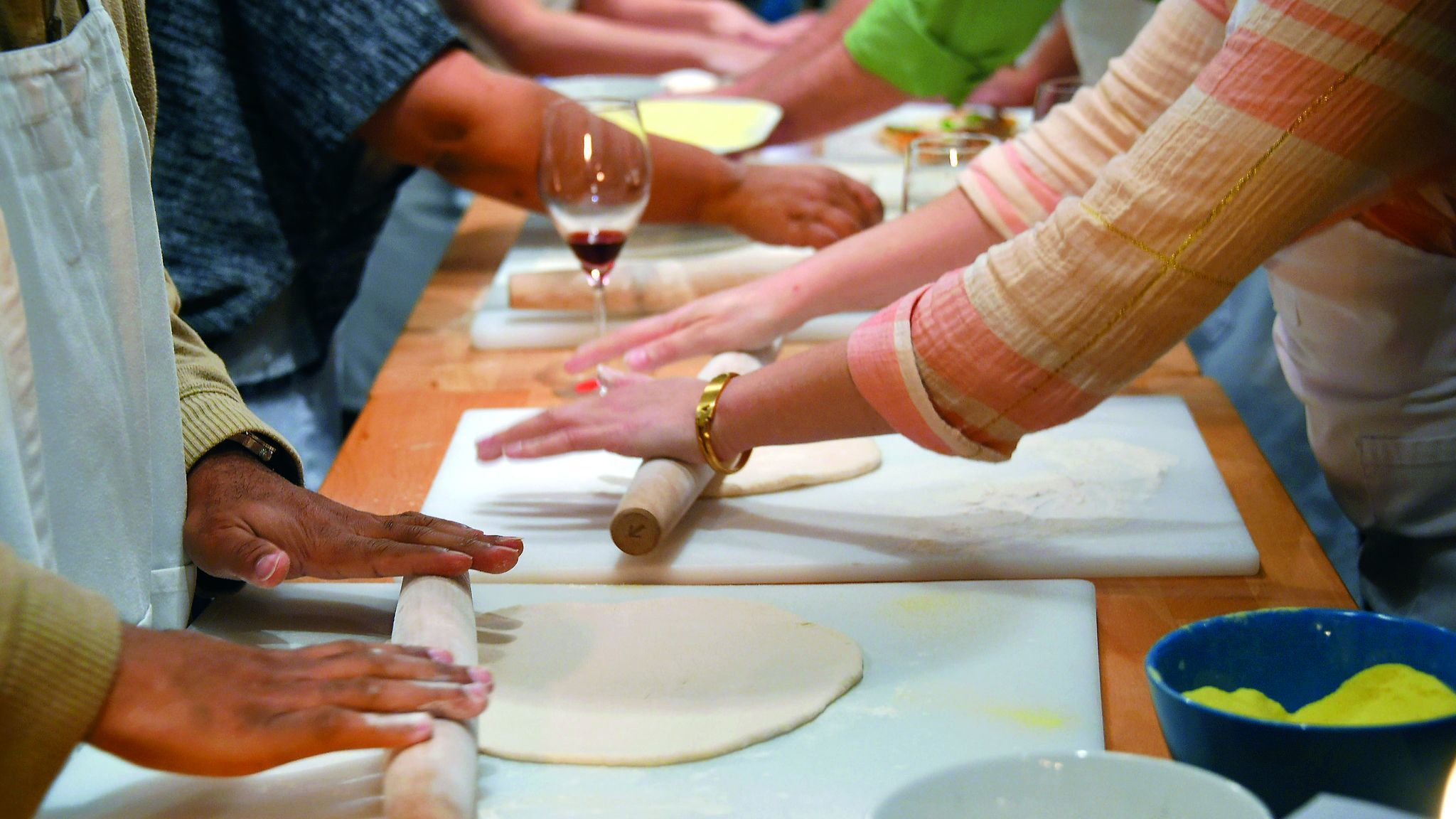 Baltimore, MD -- 11/16/2016 --Participants roll out dough during a class on making home pizza at Sch