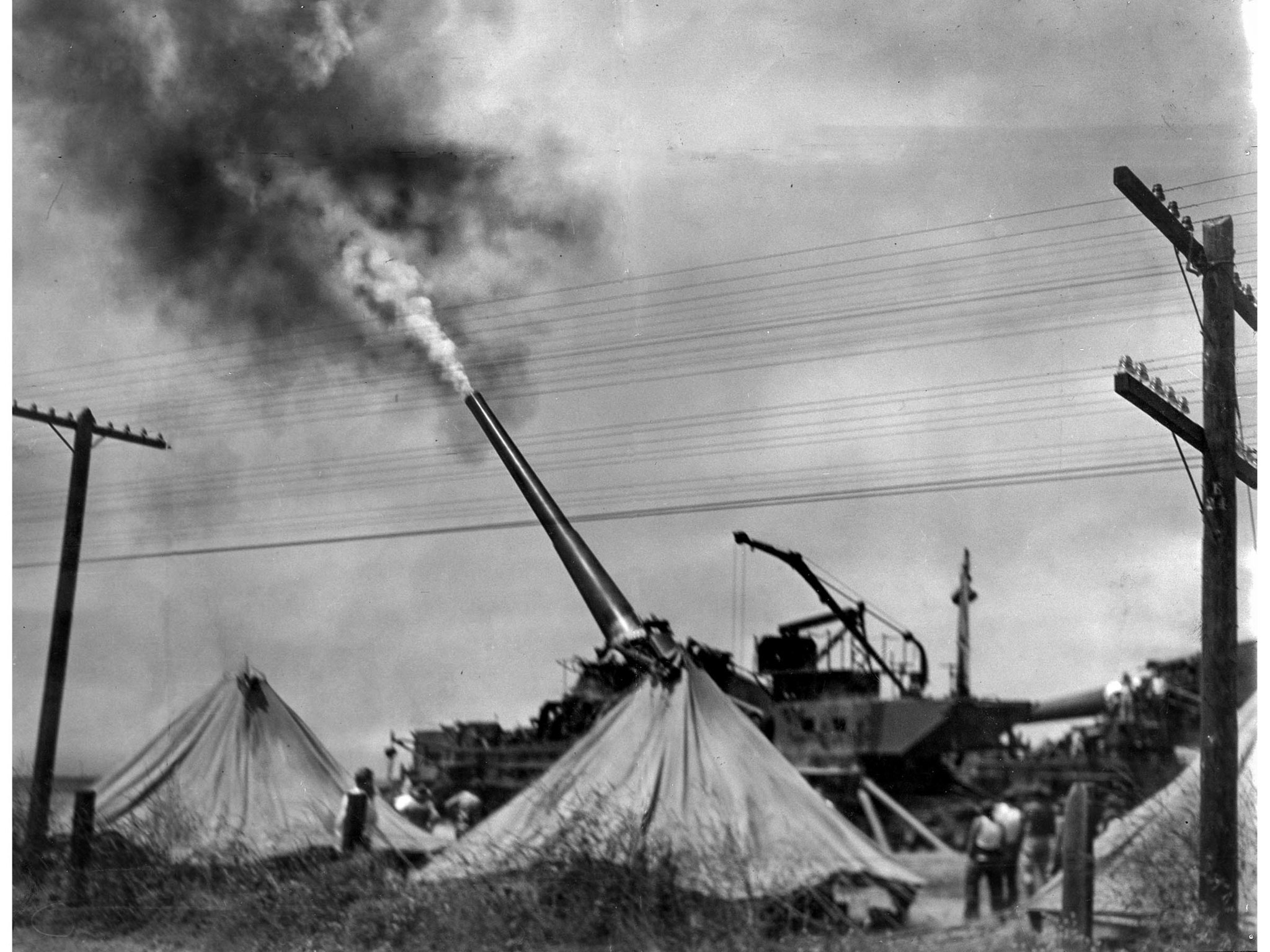 June 12, 1936: United States Army Coast Defense 14-inch railway gun is is fired during target practi