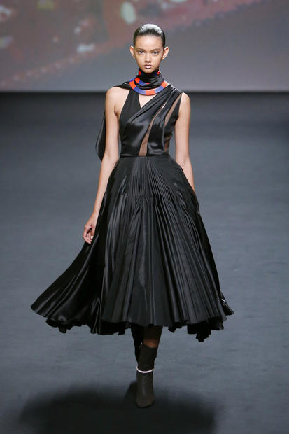 A model wears a creation by fashion designer Raf Simons for Christian ...